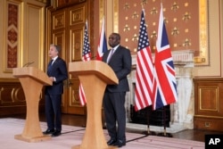 U.S. Secretary of State Antony Blinken, left, speaks during a joint press conference with Britain's Foreign Secretary David Lammy in the Locarno room at the Foreign, Commonwealth and Development Office in London, Sept. 10, 2024.