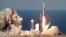  A SpaceX Falcon Heavy rocket carrying a communication satellite lifts off from pad 39A at the Kennedy Space Center in Cape Canaveral, Fla., April 11, 2019.
