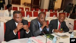 From left to right, Burundi opposition members, Ndikumana Delphine, Deputy Secretary General of the United For National Progress, Rwasa Agaton and Leonce Ngendawmana both members of the National Front of Liberation party, sit, during Burundi peace talks