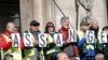 Protesters hold signs demanding freedom for Wikileaks founder Julian Assange in front of the Opera Garnier in Paris, France, Feb. 17, 2020. 