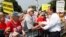 U.S. Senator Ted Cruz (R-TX) (R) greets attendees as he arrives to speak at the Tea Party Patriots 'Exempt America from Obamacare' rally on the west lawn of the U.S. Capitol in Washington, Sept. 10, 2013.