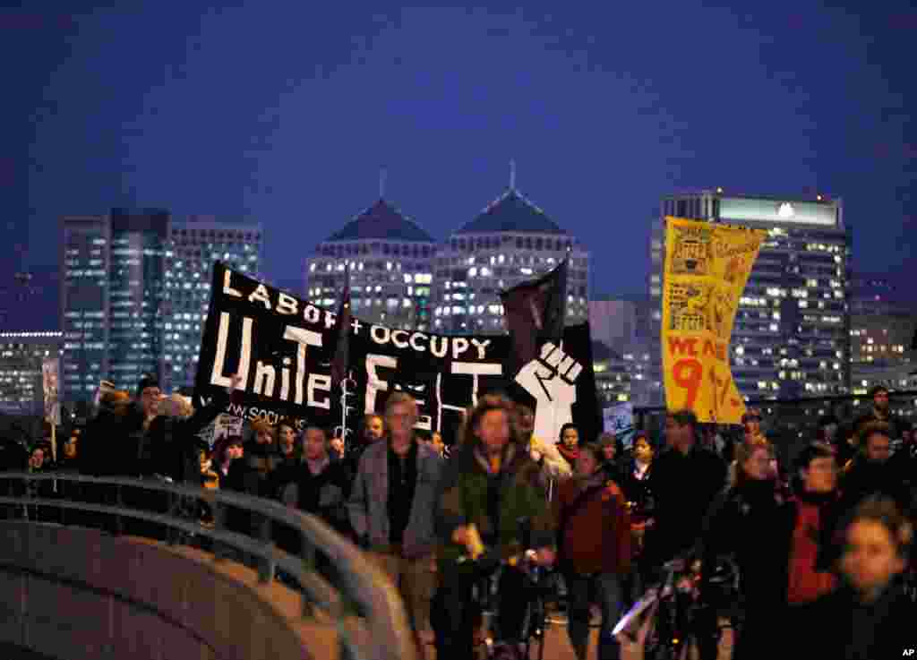 Dec. 12: Protestors march to the Port of Oakland to block the next shift of longshoremen, in Oakland, California. The movement is focusing on the ports as the "economic engines for the elite." It comes weeks after police raids cleared out most of their te