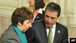 European Union foreign policy chief Catherine Ashton and NATO Secretary-General Anders Fogh Rasmussen during the informal meeting of EU Defense Ministers in Godollo, Hungary, February 25, 2011