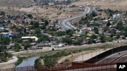 FILE - This April 22, 2020, file photo, shows Juarez, Mexico, and the Rio Grande from El Paso Texas, where U.S. border agencies quickly expelled about 600 child migrants in April.