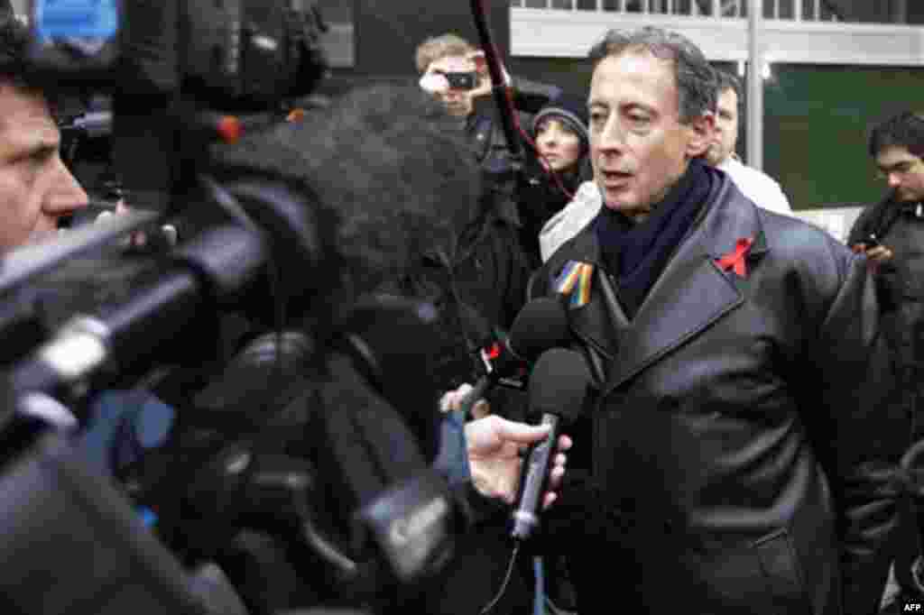 Human right campaigner, Peter Tatchell, right, a supporter of Wikileaks founder Julian Assange talks to the media as he arrives at the City of Westminster Magistrates Court in London where Julian Assange is in court for his bail hearing, Tuesday, Dec. 14,