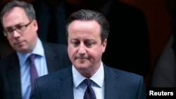 Britain's Prime Minister David Cameron leaves 10 Downing Street in London, Nov. 26, 2015. 