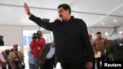 Venezuela's President Nicolas Maduro gestures during a meeting with supporters in Caracas, Venezuela, July 26, 2017.