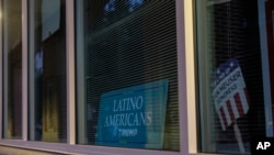 A sign is displayed at the "Latino Americans for Trump" office in Reading, Pa., June 16. The 2020 presidential election in Pennsylvania was decided by about 82,000 votes, and according to the Pew Research Center, there are more than 600,000 eligible Latino voters in the state.
