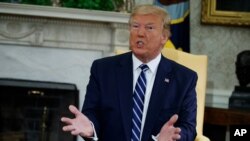 President Donald Trump speaks during a meeting with Canadian Prime Minister Justin Trudeau in the Oval Office of the White House, June 20, 2019, in Washington.