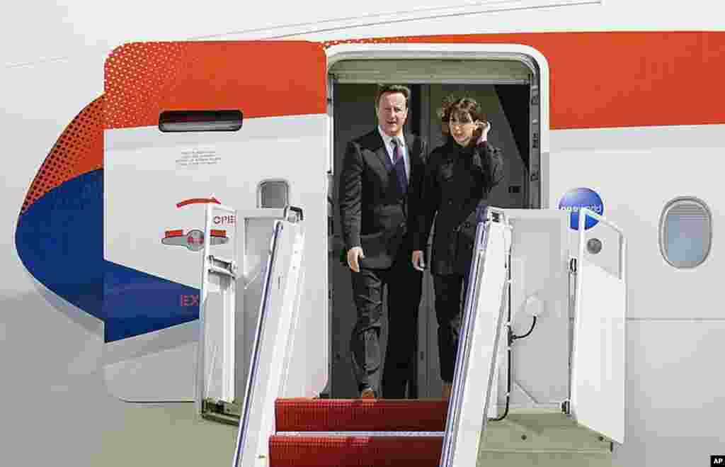 Mr. Cameron and his wife, Samantha, arrive at Andrews Air Force Base, Maryland, for a three-day official visit to the United States on March 13, 2012. (Reuters)