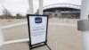 FILE - A "grounds closed" sign stands outside Empower Field at Mile High, the home of the NFL Denver Broncos, in Denver, April 30, 2020.