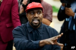 FILE - Rapper Kanye West speaks during a meeting in the Oval Office of the White House with President Donald Trump, October 11, 2018, in Washington.