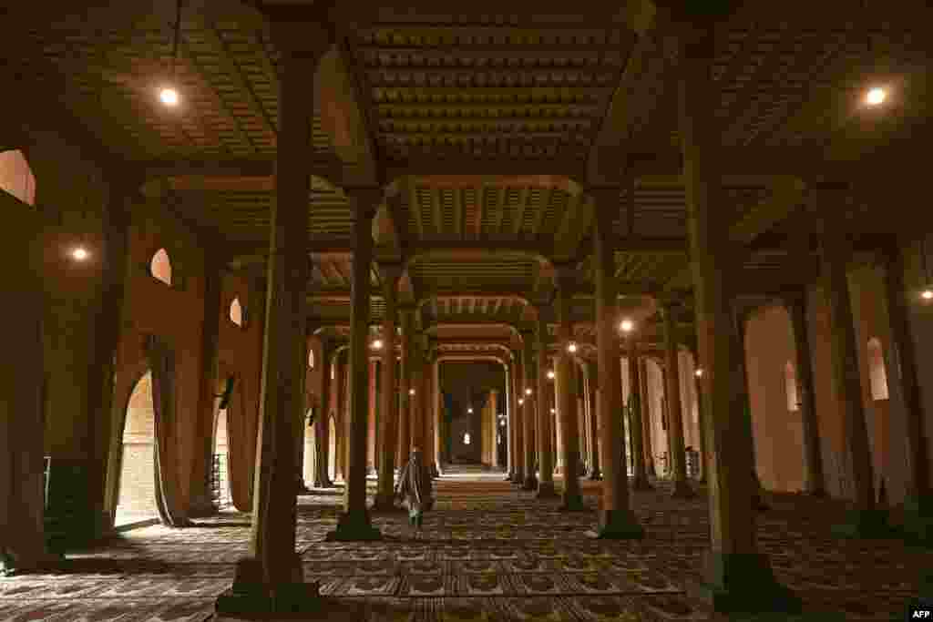 A Muslim devotee walks inside the Jamia Masjid mosque during the holy month of Ramadan in Srinagar, India.