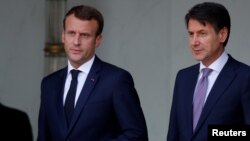 French President Emmanuel Macron accompanies Italian Prime Minister Giuseppe Conte after a meeting at the Elysee Palace in Paris, France, June 15, 2018. 
