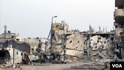 Foto ini dirilis oleh Komite Umum Revolusi Suriah tanggal 7 Maret 2012, menunjukkan salah satu sudut kota Inshaat, Homs yang hancur (Foto: dok).