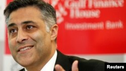 FILE - Then-Gulf Finance House CEO Ahmed Fahour speaks at a news conference held in Manama. Fahour has retired his position as CEO of Australia Post.