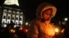 Mourners gather for a candlelight vigil at the Wisconsin State Capitol building a day after a shooting at Abundant Life Christian School, in Madison, Wisconsin, on December 17, 2024.