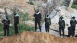 (FILE) Palestinian Hamas militants keep guard in Khan Younis in the southern Gaza Strip, Feb. 20, 2025. 