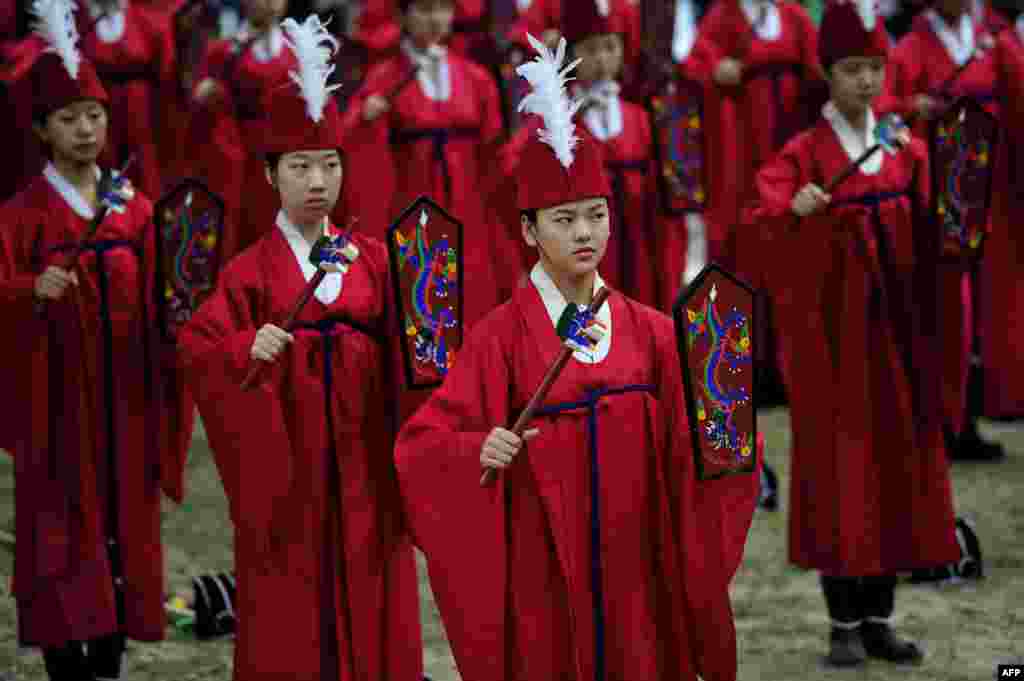 Students perform during an annual ritual ceremony to celebrate the Chinese philosopher and teacher Confucius' birthday at Sungkyunkwan University in Seoul, South Korea.