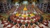 Priests arrange fruits offered by Hindu devotees inside a temple to mark the Annakut festival in Ahmedabad, India.