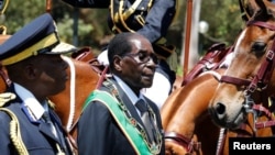 Zimbabwe's President Robert Mugabe arrives for the opening of Parliament in Harare, Zimbabwe, Oct. 6, 2016. 