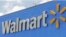 FILE- The Walmart sign is shown on June 1, 2017, in Hialeah Gardens, Fla. 
