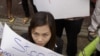 Cambodian teachers holding banners with slogans demanding the government to increase their salary and national budget for education, and to admit freedom of association, attend World Teachers Day celebrations march in Phnom Penh, on Monday.