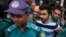 British national Hasnat Karim, center left, and University of Toronto student Tahmid Hasib Khan, center right, are taken before court in Dhaka, Bangladesh, Aug. 4, 2016.