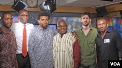 David Vendy (center) poses with members of Tosin and Afrikan Rhapsody in VOA studio.