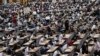 Middle school students wear protective masks as they take an entrance examination for high school in Bangkok, Thailand.