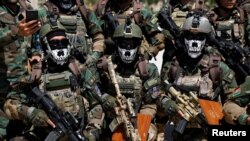 Afghan Special Forces attend their graduation ceremony in Kabul.
