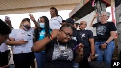 Jennifer Starr Dodd, center, and other supporters react to the sentencing of former Minneapolis police Officer Derek Chauvin for the murder of George Floyd, at George Floyd Square where Floyd was killed, in Minneapolis, June 25, 2021.