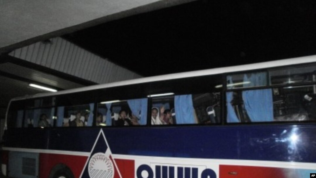 Repatriated domestic workers from the Philippines wait to return to the Overseas Workers Welfare Administration halfway house where they will receive counseling after returning from conflict-torn Syria. February 28, 2012 at Ninoy Aquino International Airp