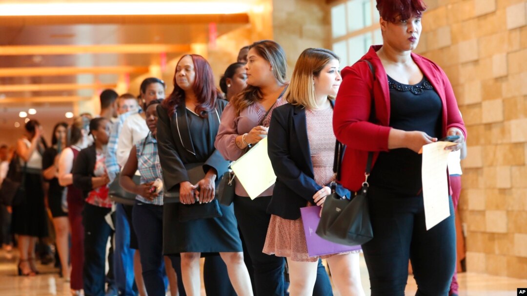 FILE - Job applicants line up at the Seminole Hard Rock Hotel & Casino Hollywood during a job fair in Hollywood, Florida, June 4, 2019. 