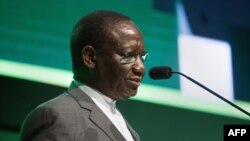 FILE -Sylvestre Ilunga DRC, speaks during the first day of the Mining Indaba in Cape Town, Feb. 3, 2020. 