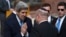 U.S. Secretary of State John Kerry, left, greets Israeli official before wreath-laying ceremony marking Israel's annual day of Holocaust remembrance, Yad Vashem, Jerusalem, April 8, 2013.