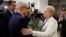 Lithuania's Prime Minister Algirdas Butkevicius (L) and center-left presidential candidate Zigmantas Balcytis (C) congratulate President Dalia Grybauskaite after her winning the presidential election in Vilnius, Lithuania, May 26, 2014. 