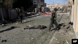 Iraqi special forces troops look for bombs in the bodies of Islamic State militants they killed during fighting in the Andalus neighborhood on the eastern side of Mosul, Jan. 16, 2017.