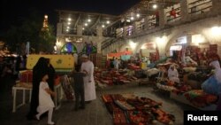 People walk at Souq Waqif in Doha, Qatar, June 9, 2017. Citizens of Qatar and other Gulf nations regularly intermarry and conduct business across countries sharing long historic and cultural bonds.