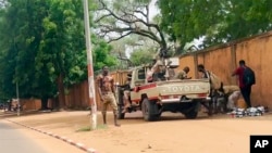 FILE - Soldiers stand in the streets of Niamey, Niger, July 28, 2023. The general who led a coup asked for support for domestic and international support, amid concerns the crisis could set back the country's fight against jihadists and increase Russia's influence in West Africa.