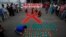Children light candles during an HIV/AIDS awareness campaign on the occasion of World AIDS Day in Kolkata, India, December 1, 2017.