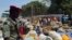 FILE - Refugees from Central Africa Republic wait for a food distribution at an UNHCR refugee camp in the eastern Cameroonian city of Garoua-Boulai, not far from the border with Central Africa Republic, March 13, 2014. 