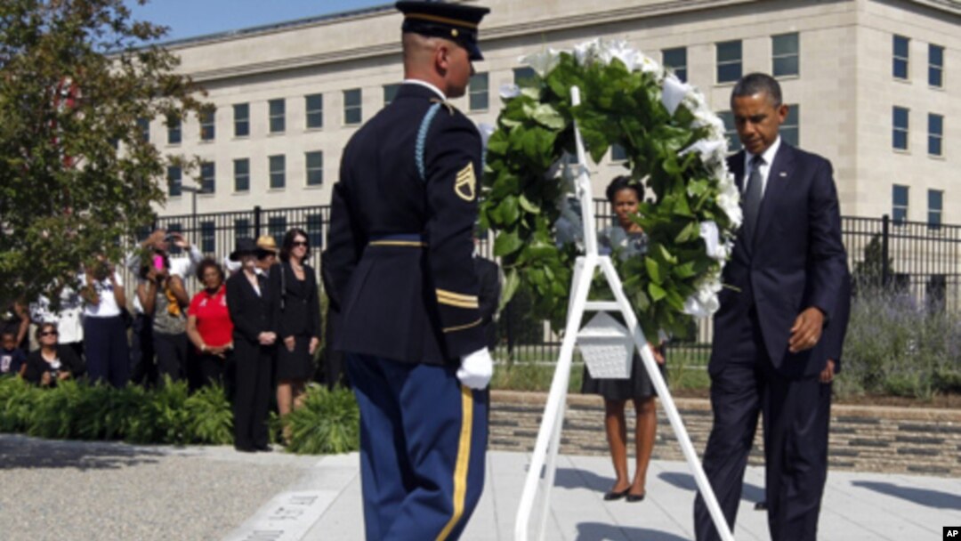President Barack Obama and first lady Michelle Obama lay a wreath as the 10th anniversary of the Sept. 11 attacks are observed at the Pentagon in Washington, Sunday, Sept. 11, 2011.