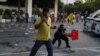 Royalists clash with pro-democracy protesters during an anti-government protest in Bangkok, Nov. 17, 2020.