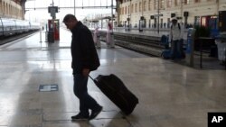 Passenger walks past an empty a platform at the Saint-Charles railway station, in Marseille , southern France, June, 1, 2016.