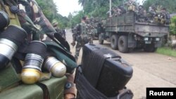 Soldiers stand guard on a road as they are deployed to remote villages in Jolo, Sulu, southern Philippines, Oct. 17, 2014. 