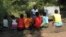 FILE - Photo taken in the Gorongosa National Park, Mozambique, shows Mozambican girls participating in a program that aims to help them stay in school longer and avoid child marriage, a longstanding problem in the southern African country, April 20, 2018. 