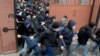 Migrants wearing protective face masks hurry to renew work and residence permits amid the spread of the novel coronavirus (COVID-19), at a migration center in Saint Petersburg, Russia.