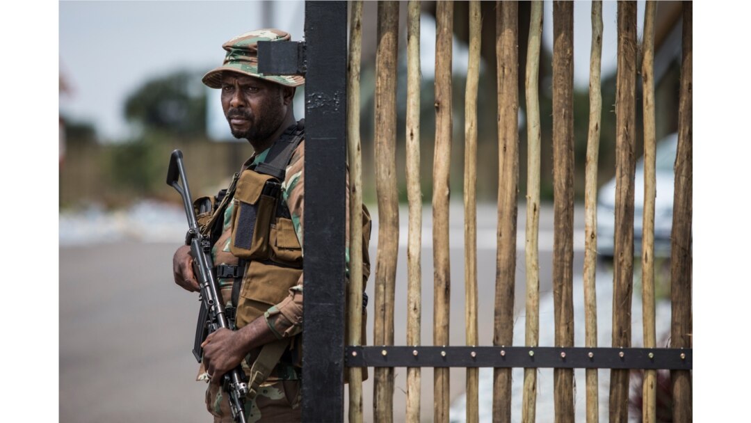 A South African Defense Force soldier stands at the entrance of The Protea Hotel Ranch Resort in Polokwane on March 13, 2020, where the 122 South African citizens evacuated from the coronavirus epicenter of Wuhan in China are to be quarantined.