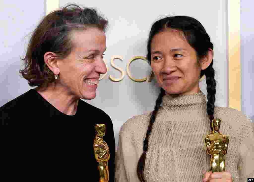 Producers Frances McDormand and Chloe Zhao, hold the Oscar for Best Picture for &quot;Nomadland&quot; as they pose in the press room at the Oscars on April 25, 2021, at Union Station in Los Angeles. - McDormand also won for Actress in a Leading Role for …